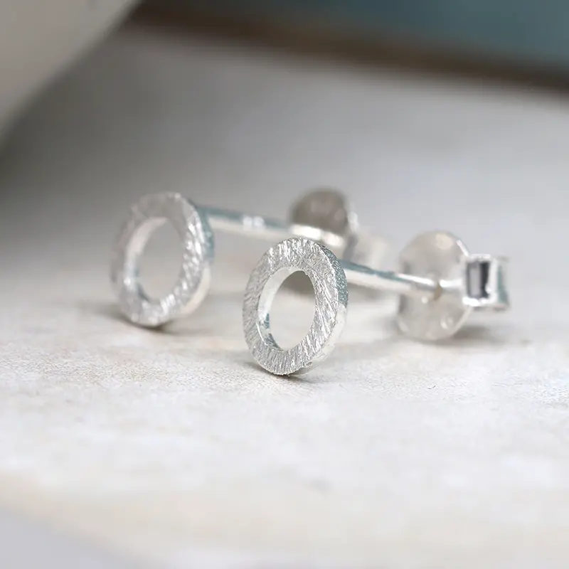 Tiny brushed silver circle studs