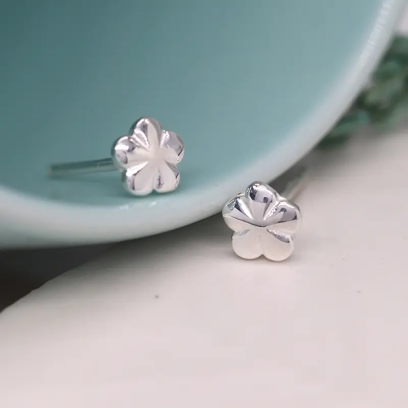 Tiny silver flower studs